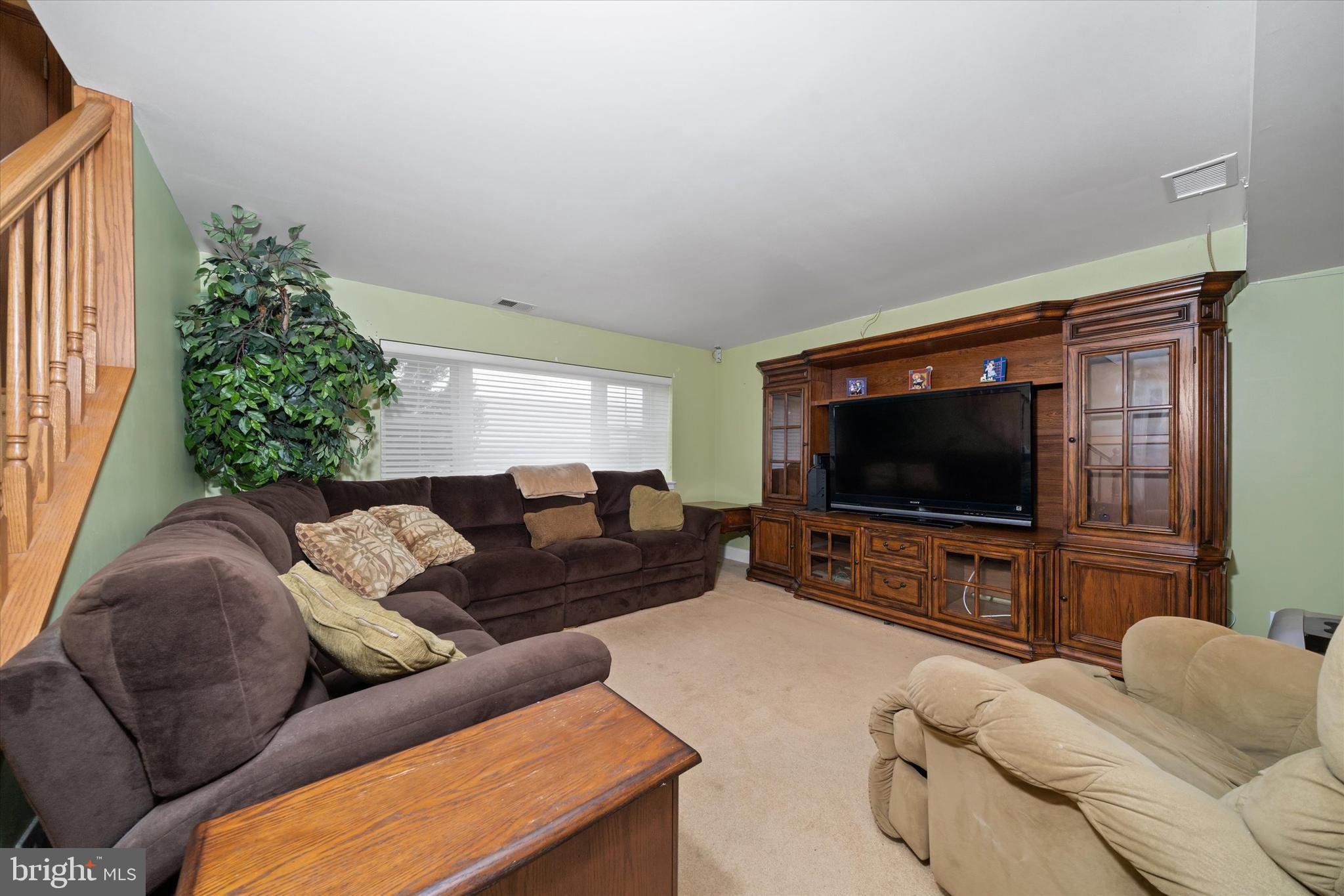 1331 Cherry Tree Road Aston, PA 19014 - Photo 25 of 40 a living room with furniture and a flat screen tv