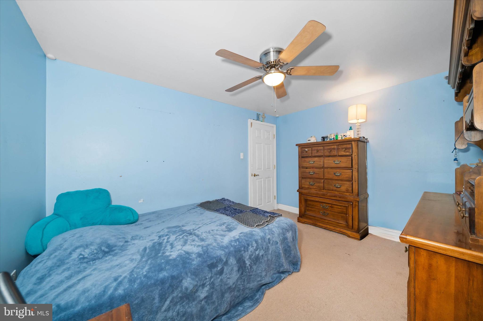 1331 Cherry Tree Road Aston, PA 19014 - Photo 29 of 40 a bedroom with a bed and a chandelier