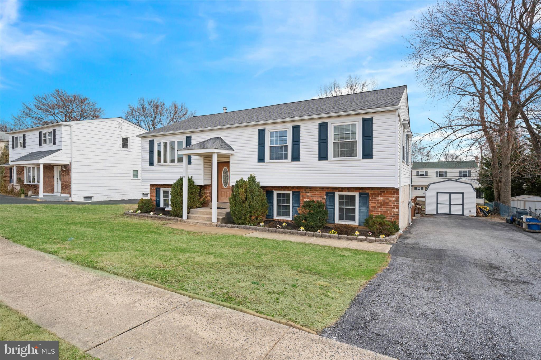 1331 Cherry Tree Road Aston, PA 19014 - Photo 3 of 40 a front view of a house with a yard and trees