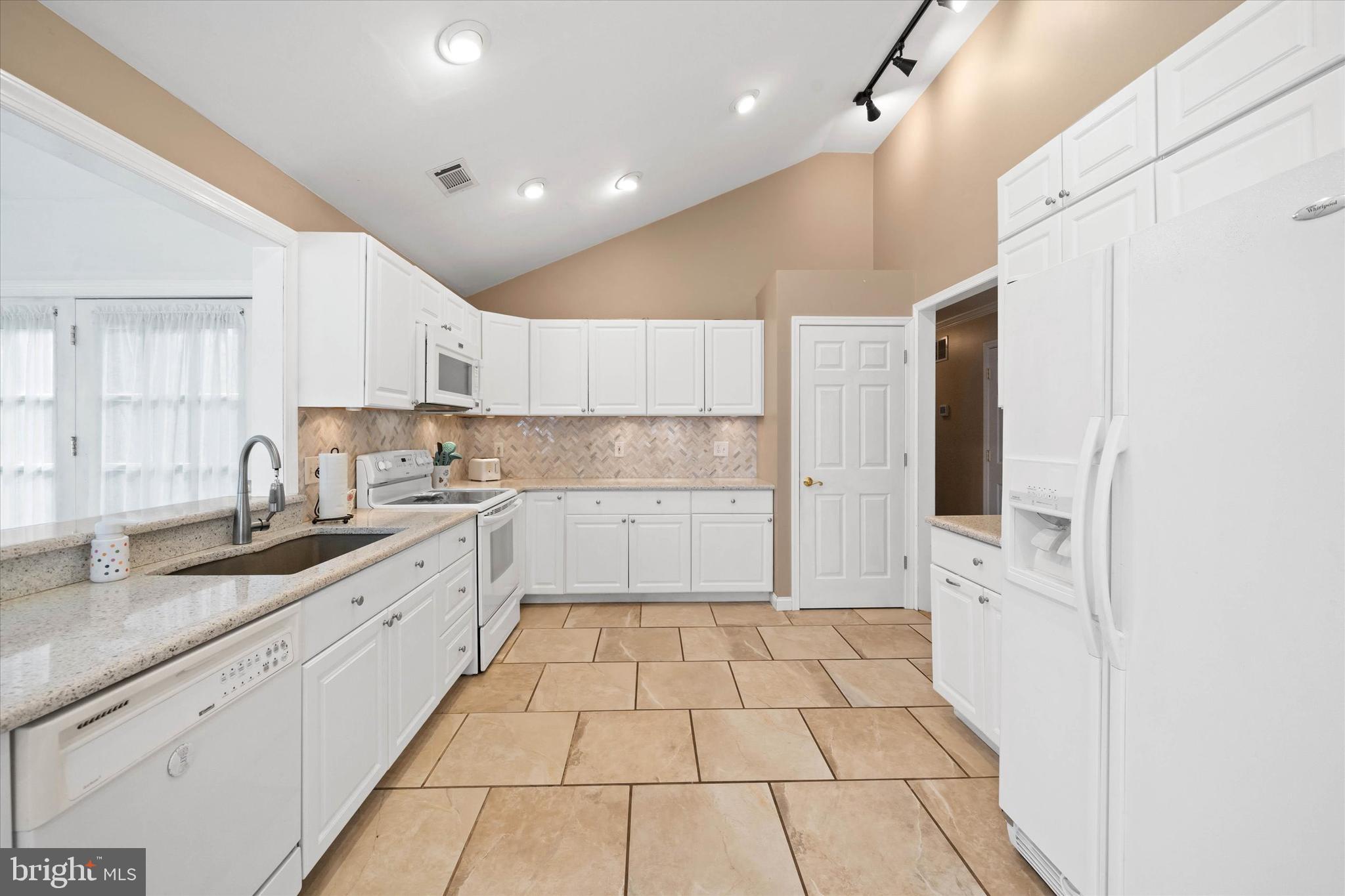 1331 Cherry Tree Road Aston, PA 19014 - Photo 9 of 40 a large kitchen with a sink and cabinets