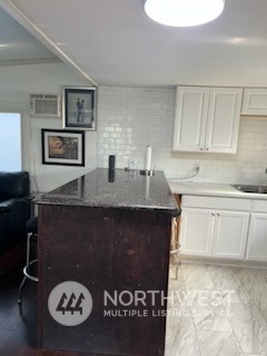 3612 Northeast 4th Street, Unit 18 Renton, WA 98056 - Photo 3 of 16 a kitchen with a sink a stove and cabinets