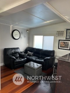 3612 Northeast 4th Street, Unit 18 Renton, WA 98056 - Photo 7 of 16 a living room with furniture a window and wooden floor