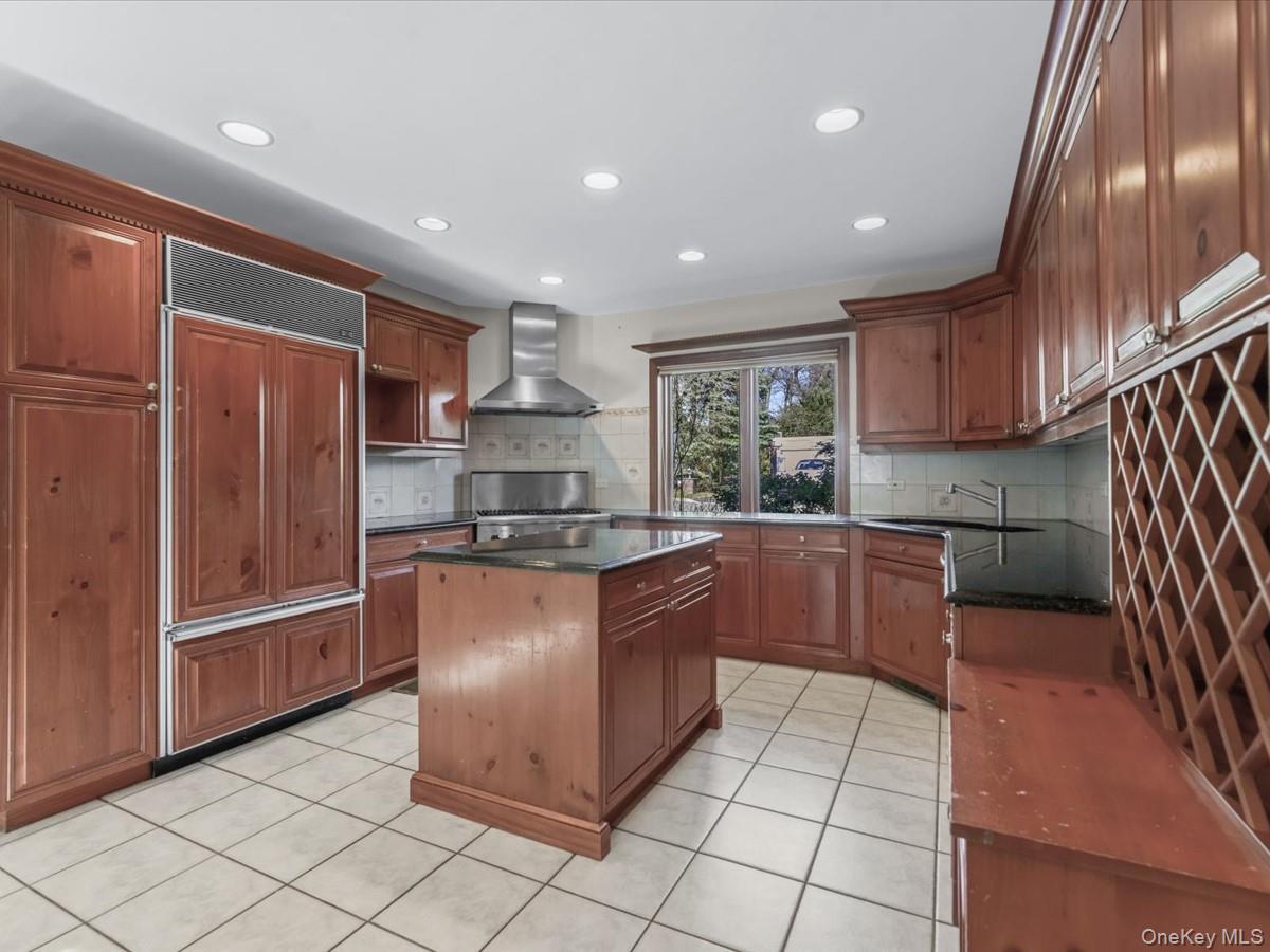 2 Amherst Road Great Neck, NY 11021 - Photo 13 of 45 a kitchen with stainless steel appliances granite countertop a refrigerator and a sink