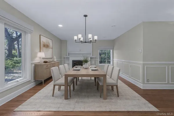 a view of a dining room with furniture window and wooden floor