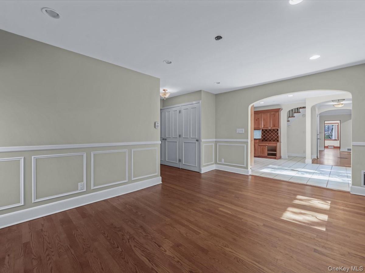 2 Amherst Road Great Neck, NY 11021 - Photo 18 of 45 an empty room with wooden floor and windows