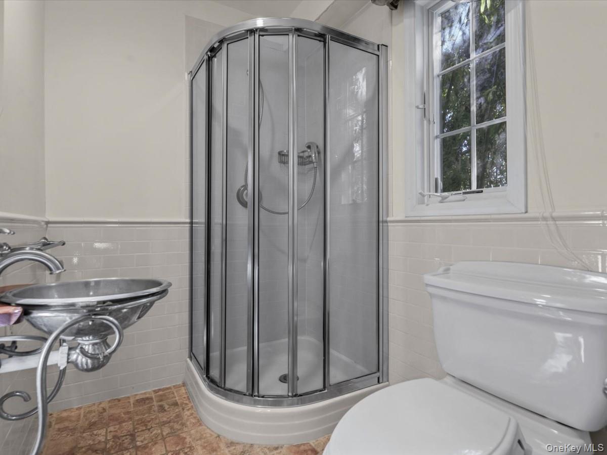 2 Amherst Road Great Neck, NY 11021 - Photo 20 of 45 a bathroom with a toilet and shower