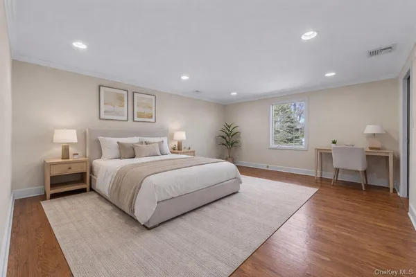 a bedroom with a large bed and a table