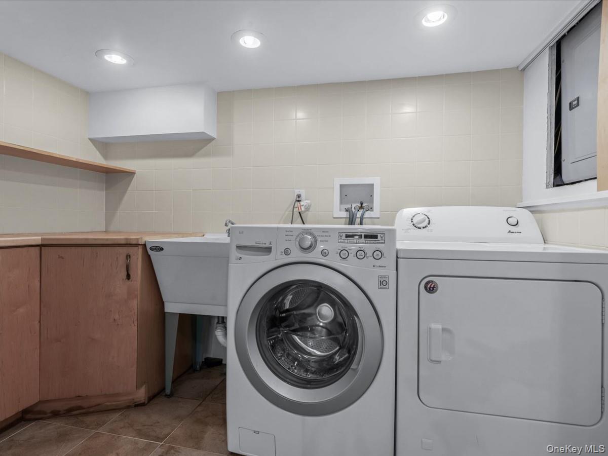 2 Amherst Road Great Neck, NY 11021 - Photo 38 of 45 a utility room with dryer and washer