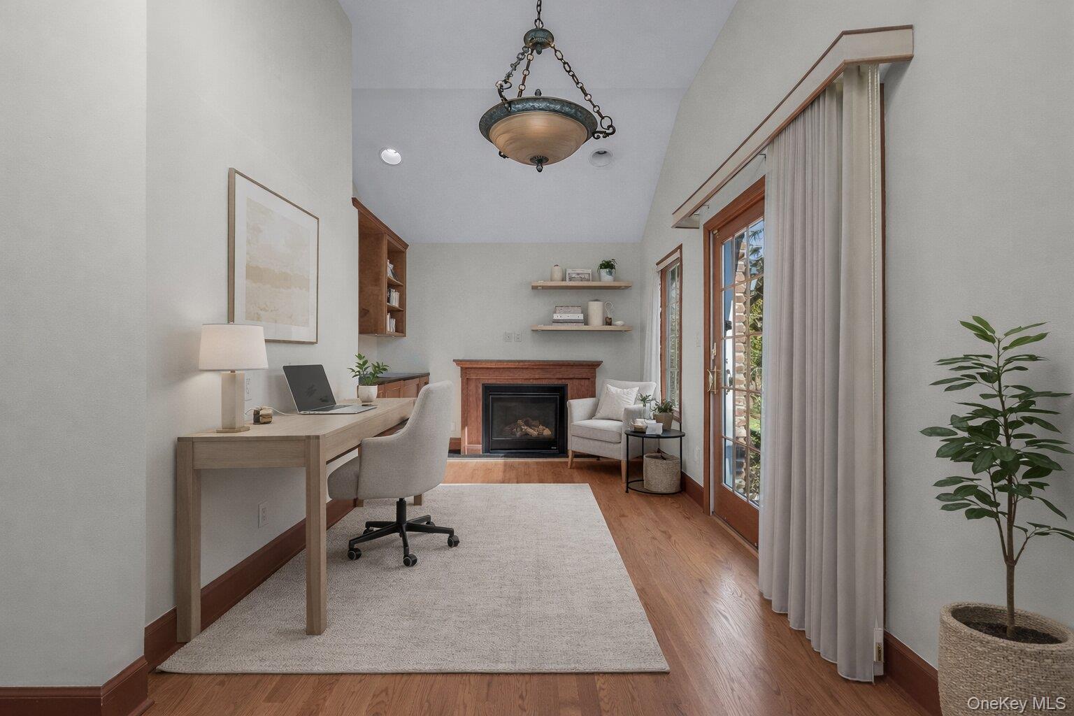 2 Amherst Road Great Neck, NY 11021 - Photo 9 of 45 a living room with furniture and a fireplace