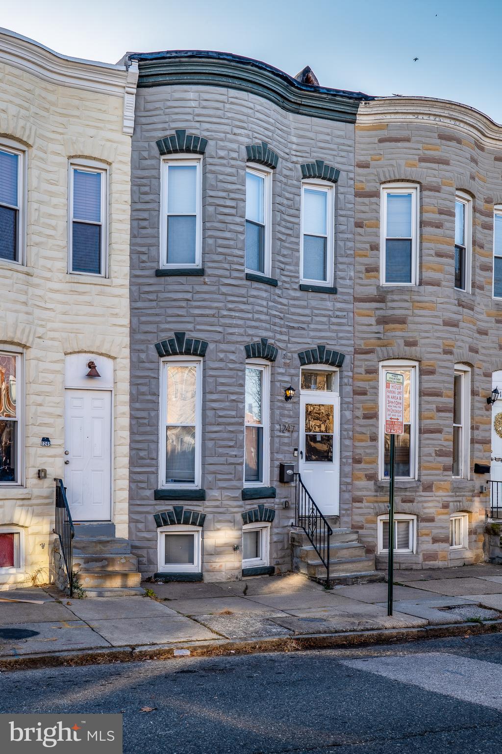 1247 Carroll Street Baltimore, MD 21230 - Photo 2 of 24 a front view of a house with yard
