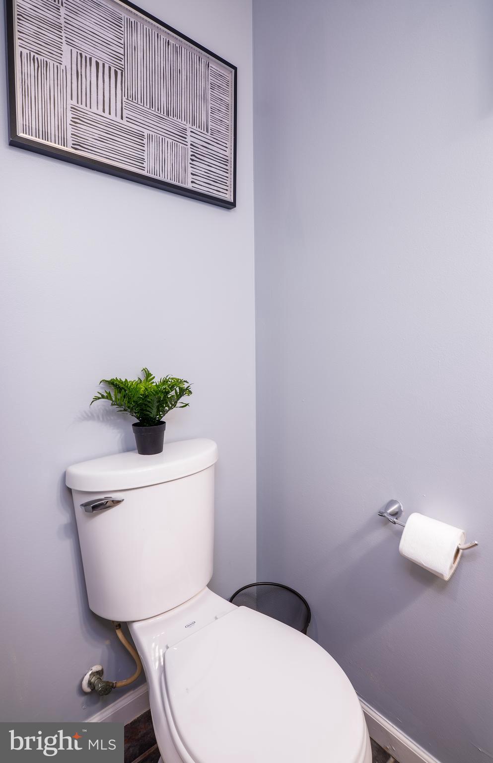 1247 Carroll Street Baltimore, MD 21230 - Photo 6 of 24 a white toilet sitting next to a white wall