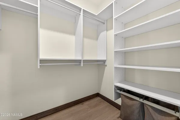a view of an empty walk in closet