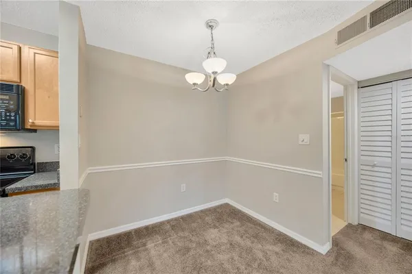 a view of a storage & utility room with a washer dryer