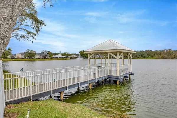 a view of a lake with houses in the back