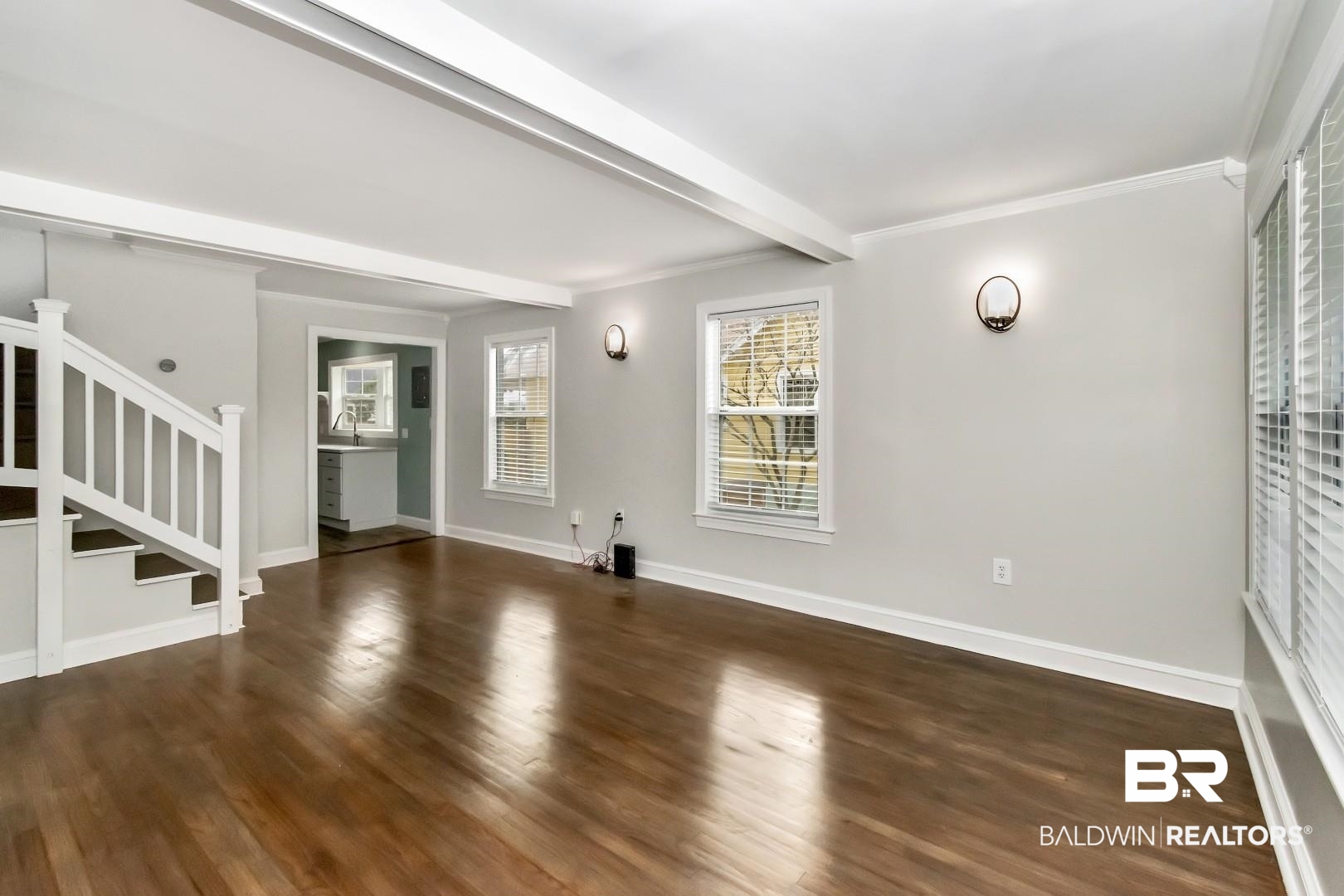 2157 Homewood Street Mobile, AL 36606 - Photo 3 of 36 Unfurnished living room with wood finished floors, baseboards, stairway, beamed ceiling, and crown molding