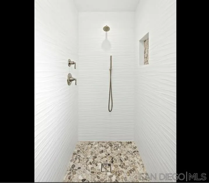 6512 Surfside Lane Carlsbad, CA 92011 - Photo 9 of 26 a bathroom with a shower