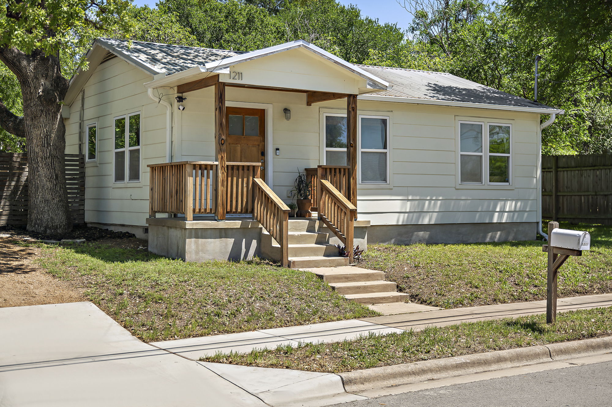 1211 Alexander Avenue Austin, TX 78702 - Photo 1 of 34 a front view of a house with a yard