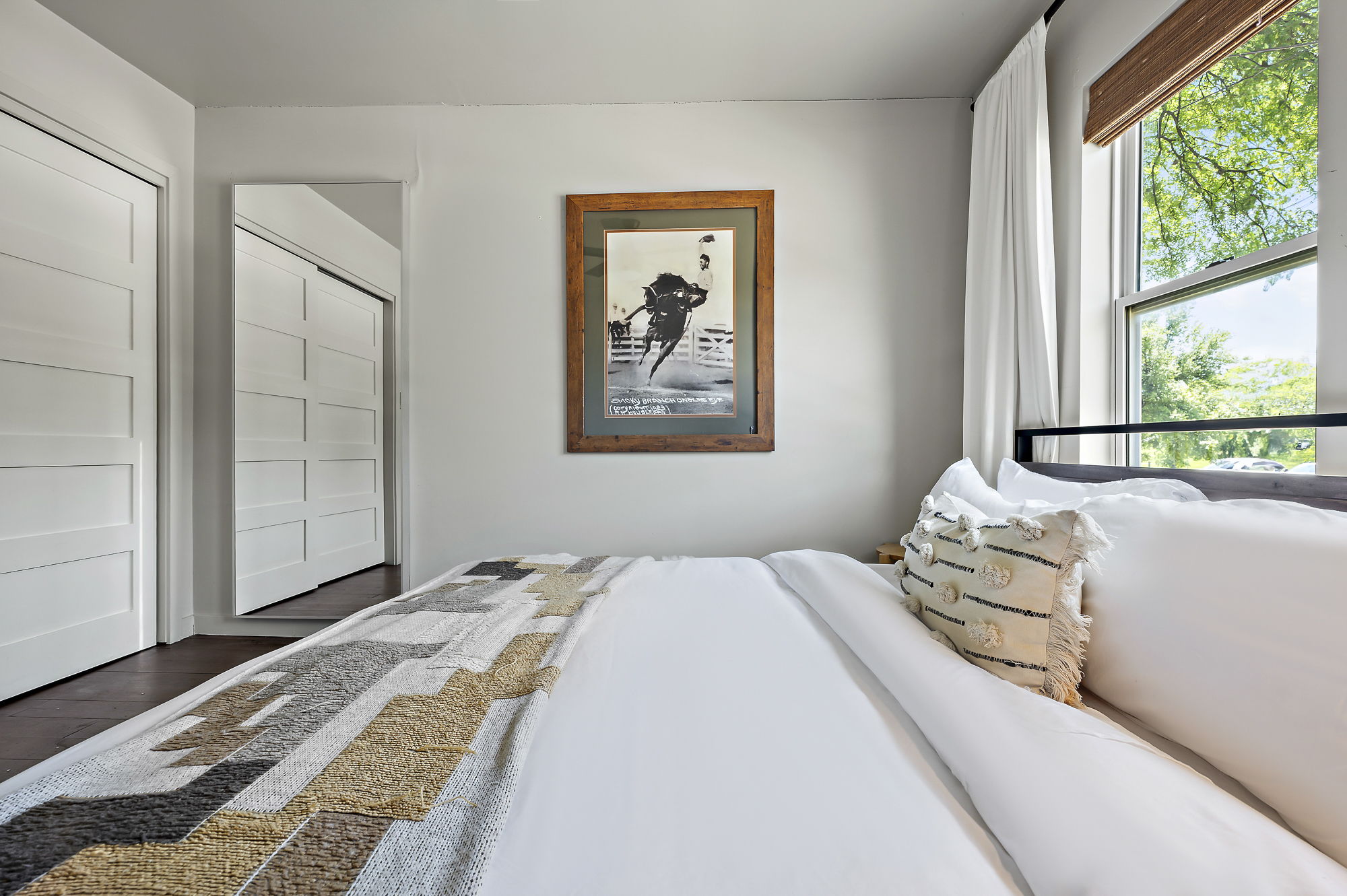 1211 Alexander Avenue Austin, TX 78702 - Photo 25 of 34 a bedroom with a bed and a painting on the wall