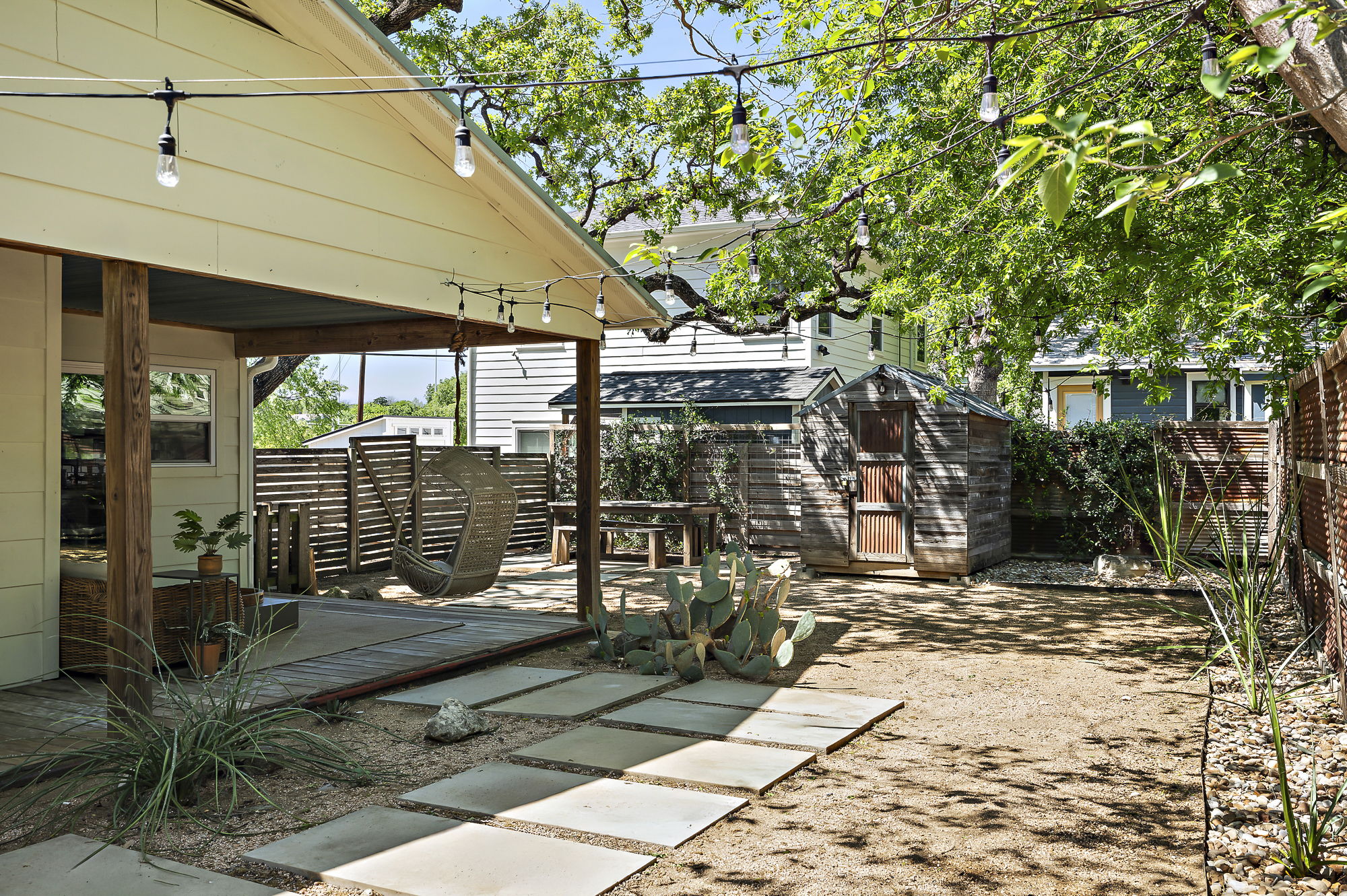 1211 Alexander Avenue Austin, TX 78702 - Photo 33 of 34 a view of a patio with table and chairs and potted plants