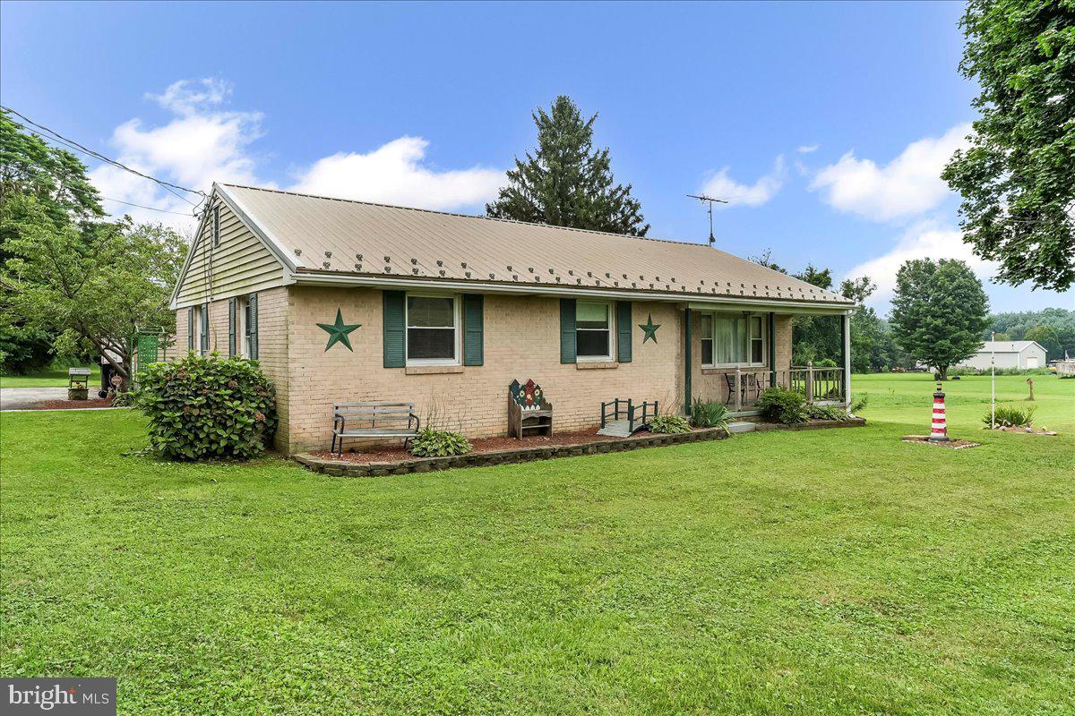 374 Street Road Cochranville, PA 19330 - Photo 1 of 28 a view of a house with a backyard