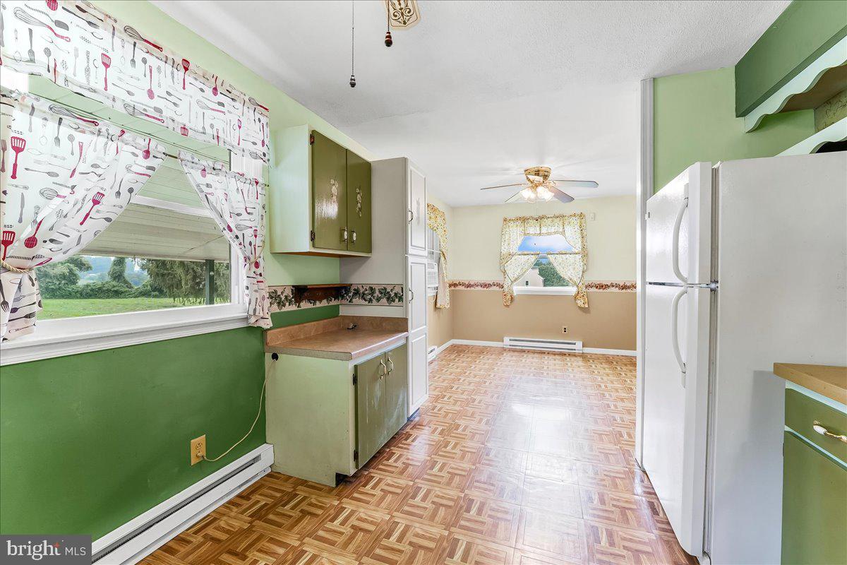 374 Street Road Cochranville, PA 19330 - Photo 11 of 28 a kitchen with a refrigerator and a sink