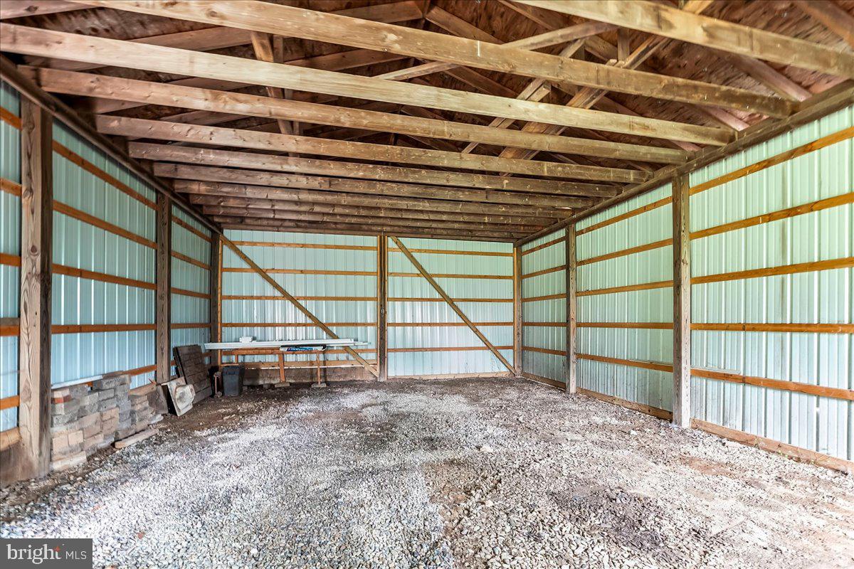 374 Street Road Cochranville, PA 19330 - Photo 19 of 28 a view of empty room with wooden floor and roof