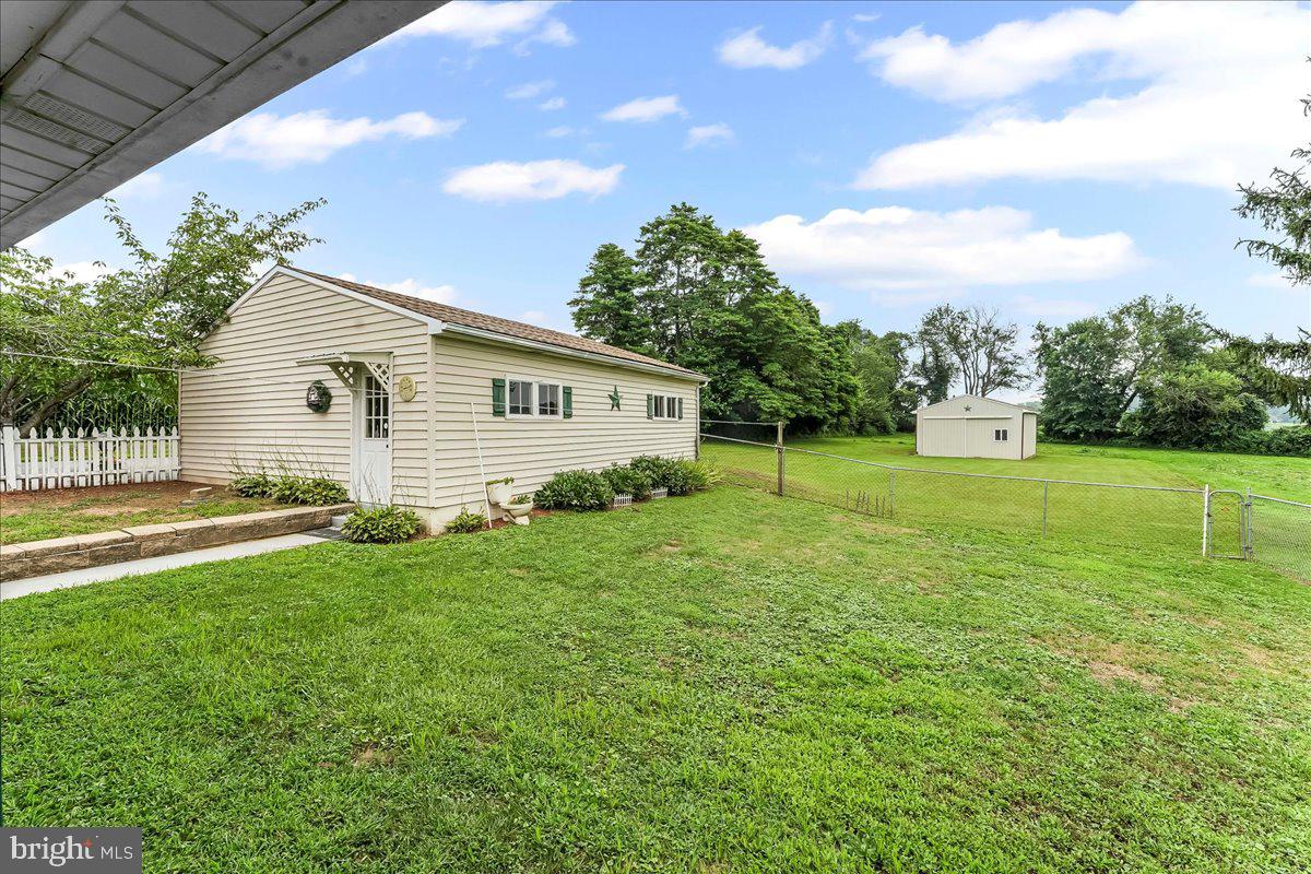 374 Street Road Cochranville, PA 19330 - Photo 22 of 28 a view of a backyard with a garden and plants