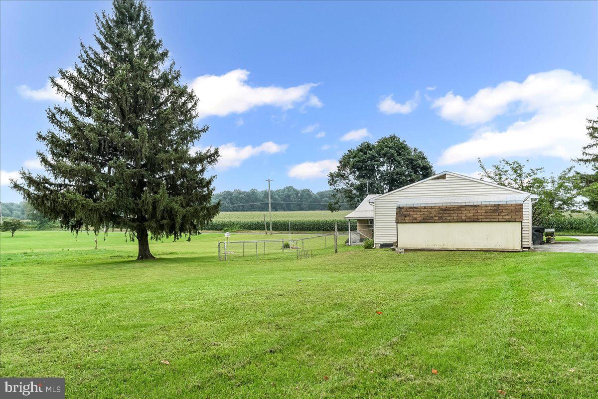 374 Street Road Cochranville, PA 19330 - Photo 26 of 28 a view of three house with a big yard