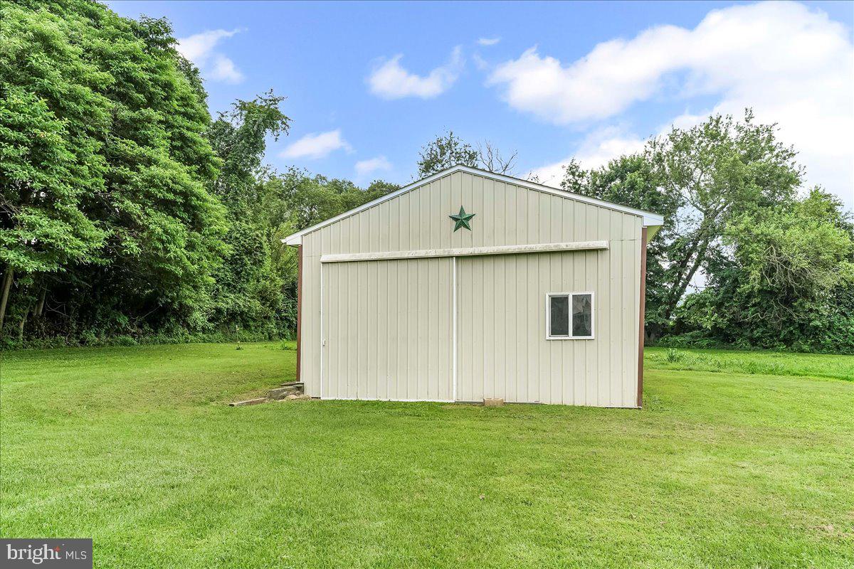 374 Street Road Cochranville, PA 19330 - Photo 27 of 28 a view of a backyard with barn
