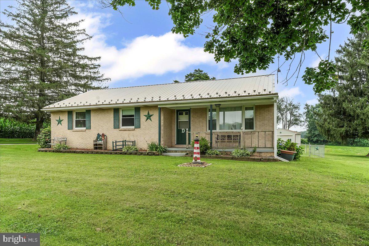 374 Street Road Cochranville, PA 19330 - Photo 3 of 28 a view of a house with a yard