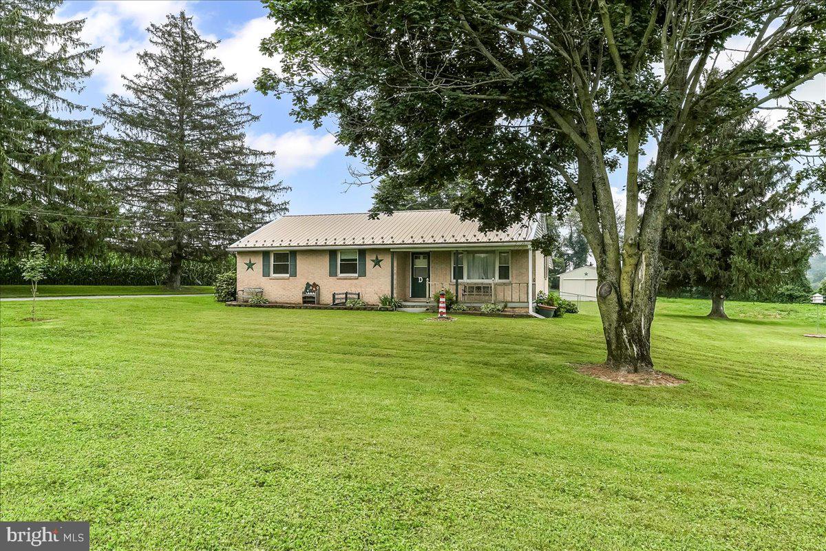 374 Street Road Cochranville, PA 19330 - Photo 4 of 28 a front view of a house with garden