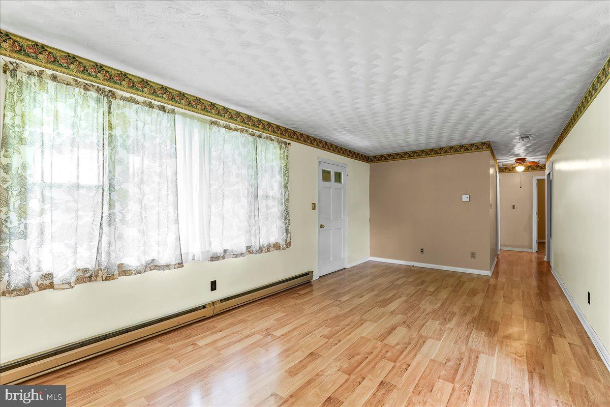 374 Street Road Cochranville, PA 19330 - Photo 6 of 28 a view of an empty room with a window