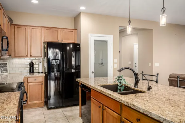 a kitchen with refrigerator cabinets and outdoor space