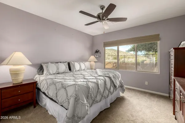 a bedroom with a large bed and a window