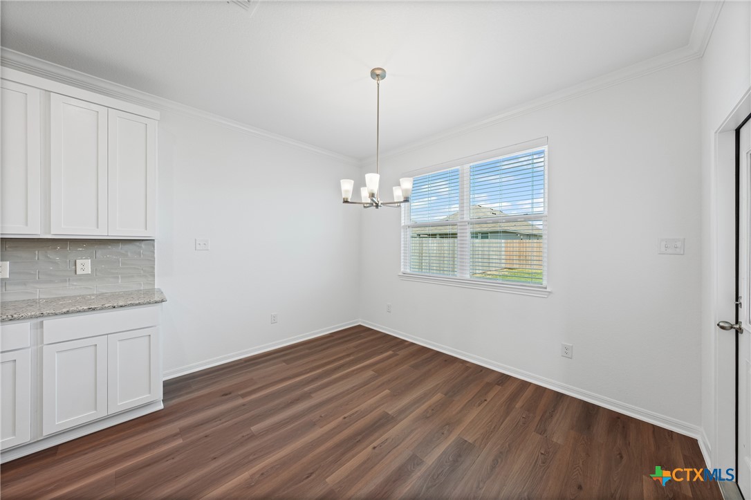 7906 Timber Holw Lane Temple, TX 76502 - Photo 16 of 29 a view of a kitchen with wooden floor and a sink