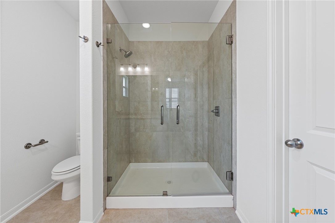 7906 Timber Holw Lane Temple, TX 76502 - Photo 24 of 29 a bathroom with a shower and a toilet