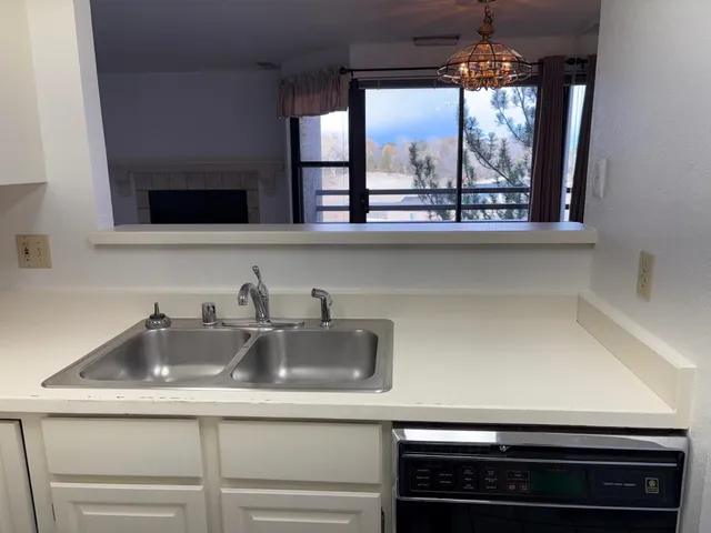 a kitchen with a sink and a window