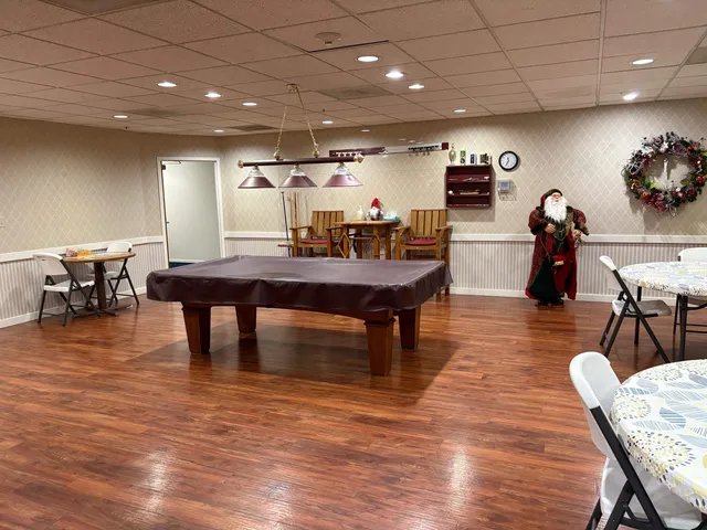 a living room with furniture window and wooden floor