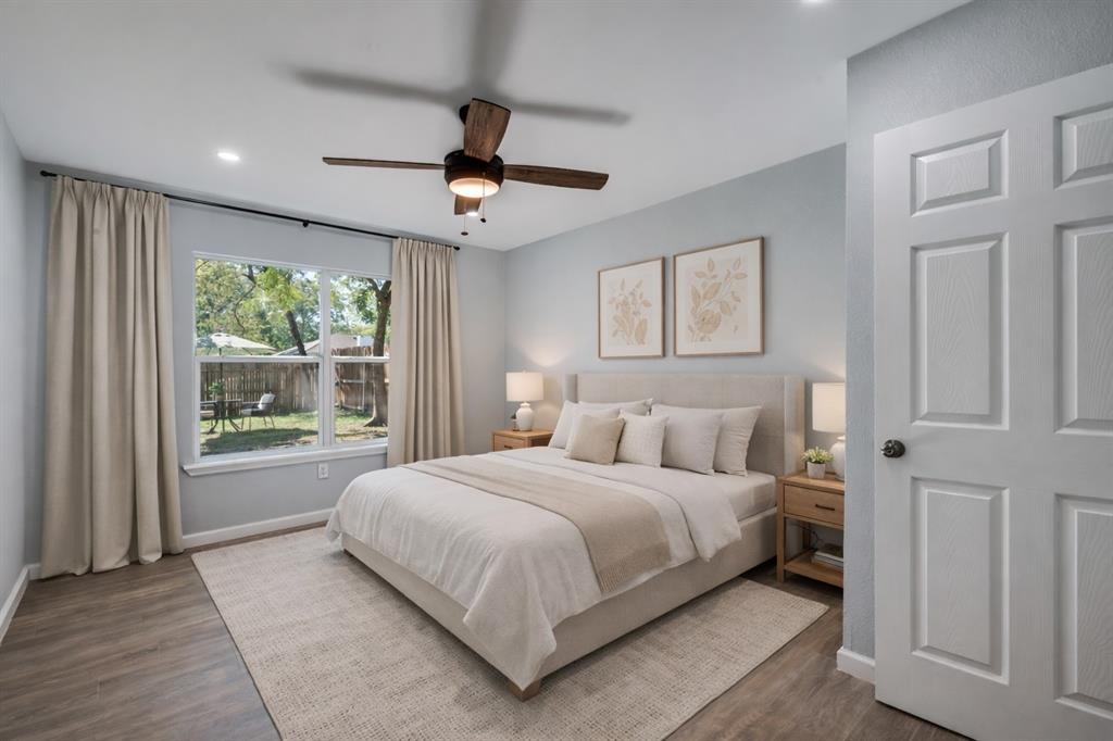 718 Glen Rhea Drive Lake Dallas, TX 75065 - Photo 11 of 23 a bedroom with a large bed and a large window