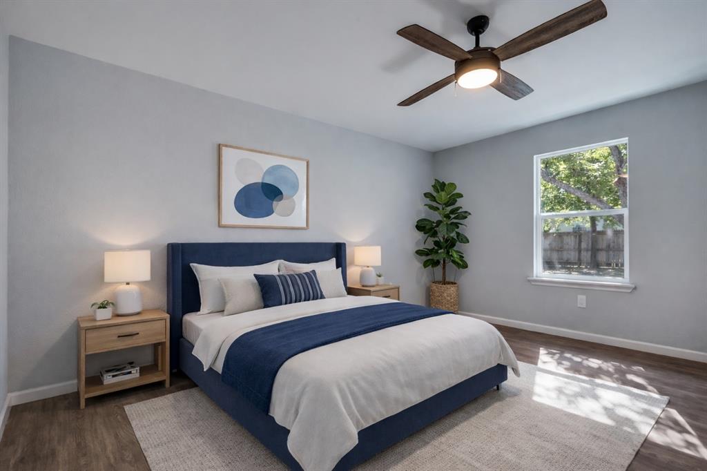 718 Glen Rhea Drive Lake Dallas, TX 75065 - Photo 16 of 23 a bedroom with a bed and a potted plant