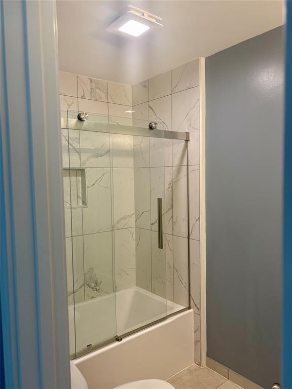 718 Glen Rhea Drive Lake Dallas, TX 75065 - Photo 19 of 23 a bathroom with a shower and bathtub