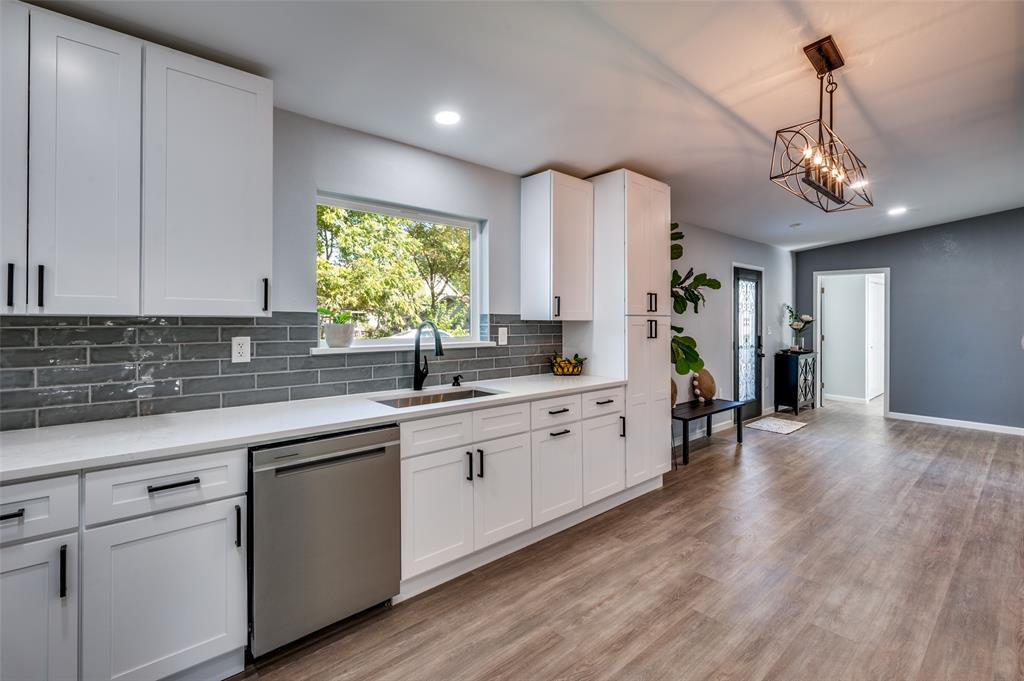 718 Glen Rhea Drive Lake Dallas, TX 75065 - Photo 10 of 23 a large kitchen with cabinets and wooden floor