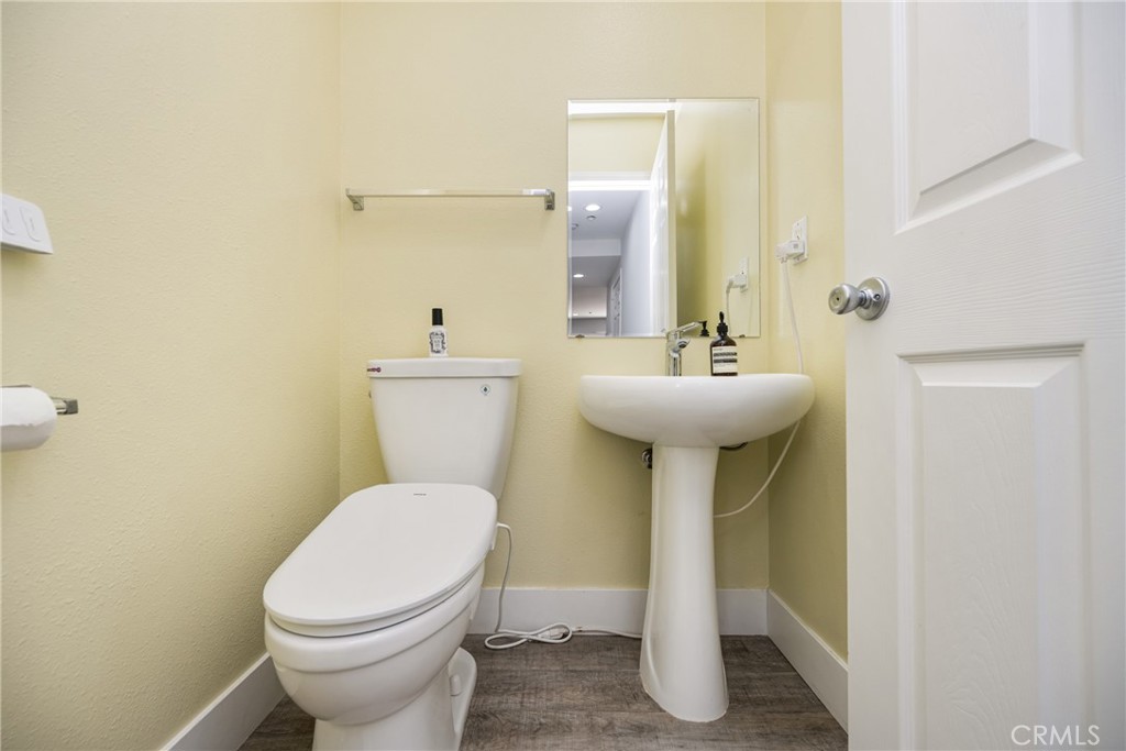 418 East Olive Avenue, Unit B Monrovia, CA 91016 - Photo 15 of 40 a bathroom with a sink a toilet and mirror