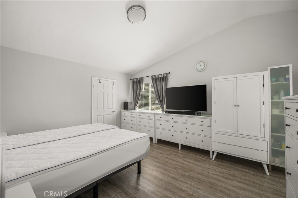 418 East Olive Avenue, Unit B Monrovia, CA 91016 - Photo 18 of 41 a bedroom with a bed and flat screen tv