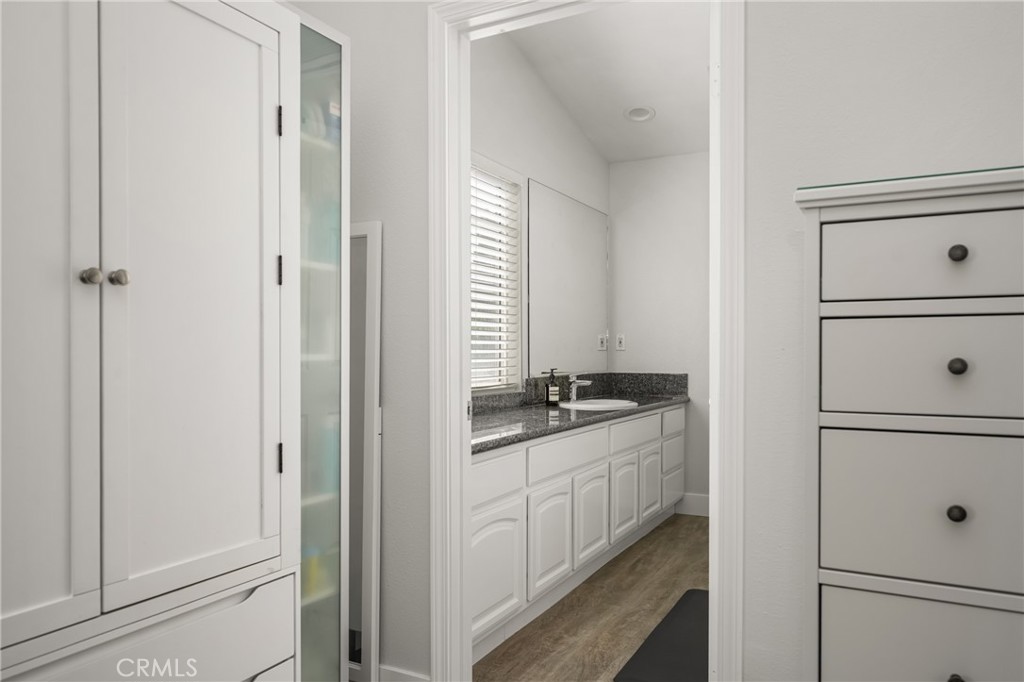 418 East Olive Avenue, Unit B Monrovia, CA 91016 - Photo 20 of 40 a bathroom with a granite countertop sink and a mirror