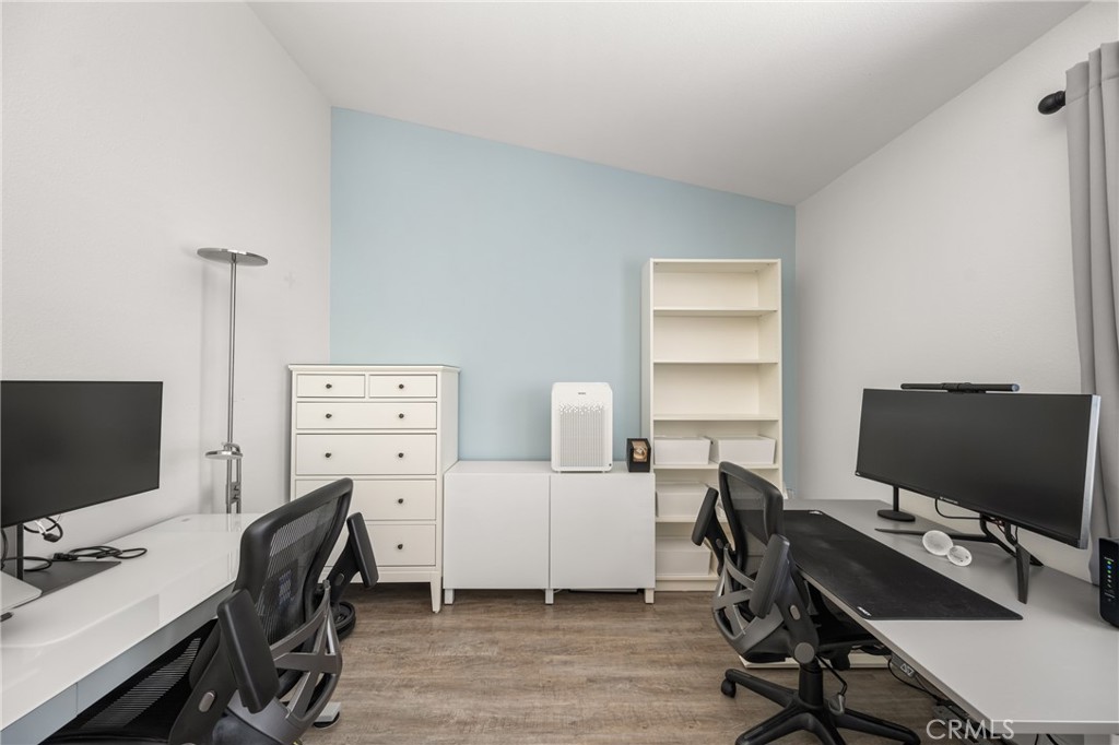 418 East Olive Avenue, Unit B Monrovia, CA 91016 - Photo 27 of 40 a view of a workspace with furniture and wooden floor