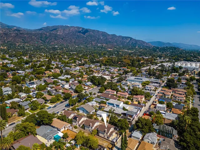 an aerial view of residential house and green space