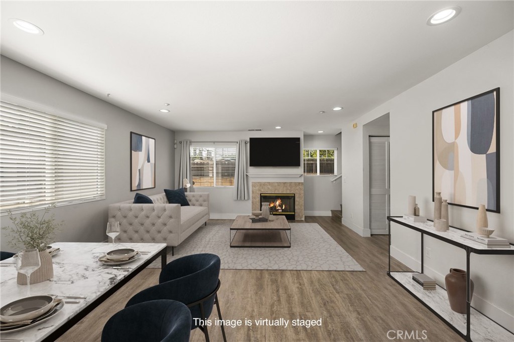 418 East Olive Avenue, Unit B Monrovia, CA 91016 - Photo 4 of 41 a living room with furniture and a flat screen tv