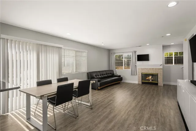 a living room with furniture and fireplace