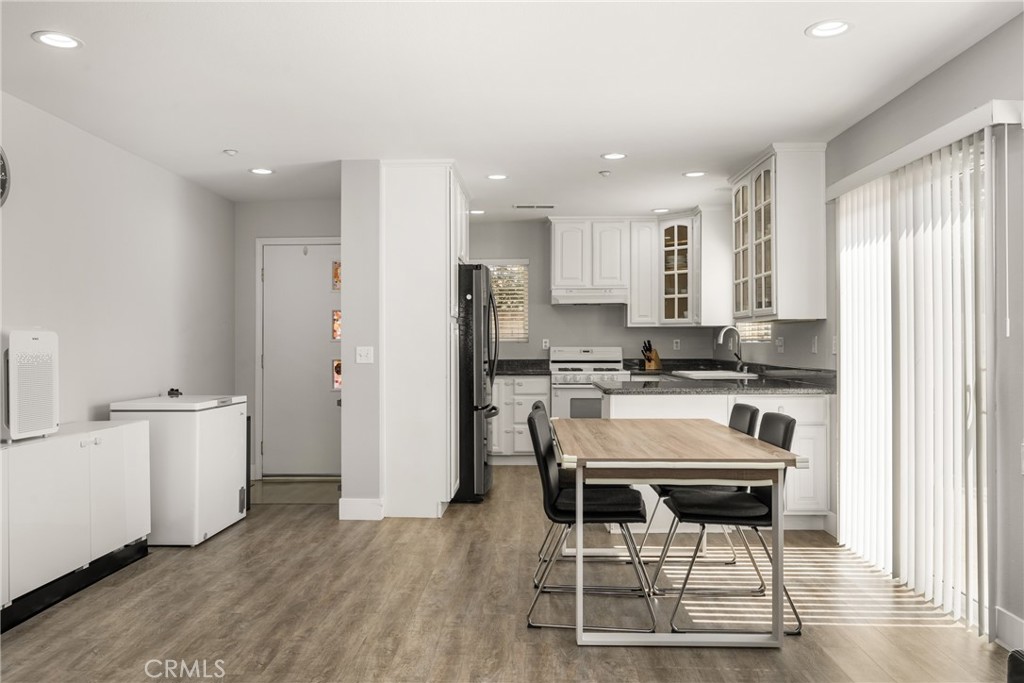 418 East Olive Avenue, Unit B Monrovia, CA 91016 - Photo 9 of 40 a kitchen with stainless steel appliances kitchen island granite countertop a refrigerator and a stove top oven